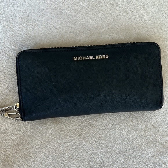 Black Michael Kors purse with gold detailing and long strap - Picture 5 of 8